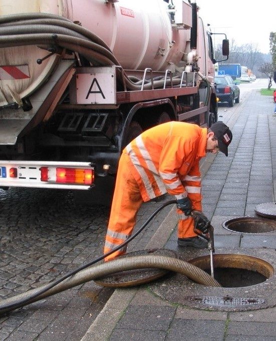 A man cleaning the septic tank